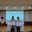 수진2동장과 한전MCS(주)성남지점장이 협약서를 들고 기념촬영을 하고 있다..jpg